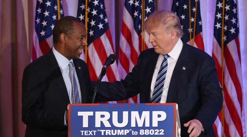 PALM BEACH, FL - MARCH 11: Republican presidential candidate Donald Trump stands with former presidential candidate Ben Carson as he receives his endorsement at the Mar-A-Lago Club on March 11, 2016 in Palm Beach, Florida. Presidential candidates continue to campaign before Florida's March 15th primary day. (Photo by Joe Raedle/Getty Images)