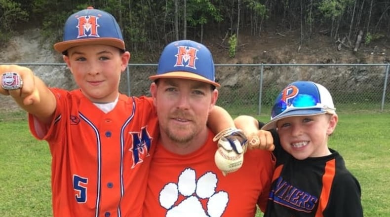 Brandon Wilson (center) drowned in Lake Hartwell on Saturday. He is survived by his two sons, Pierce (left) and Garrett, and his wife Jenny.