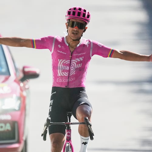 Ecuador's Richard Carapaz celebrates as he crosses the finish line to win the eighteenth stage of the Tour de France cycling race, with start in Voiron and finish in Orcieres-Merlette, France, Thursday, July 23, 2026. (AP Photo/Mosa'ab Elshamy)