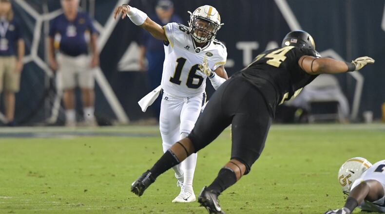 October 21, 2017 Atlanta - Georgia Tech quarterback TaQuon Marshall (16) gets off a pass in the first half of an NCAA college football game at Bobby Dodd Stadium on Saturday, October 21, 2017. HYOSUB SHIN / HSHIN@AJC.COM