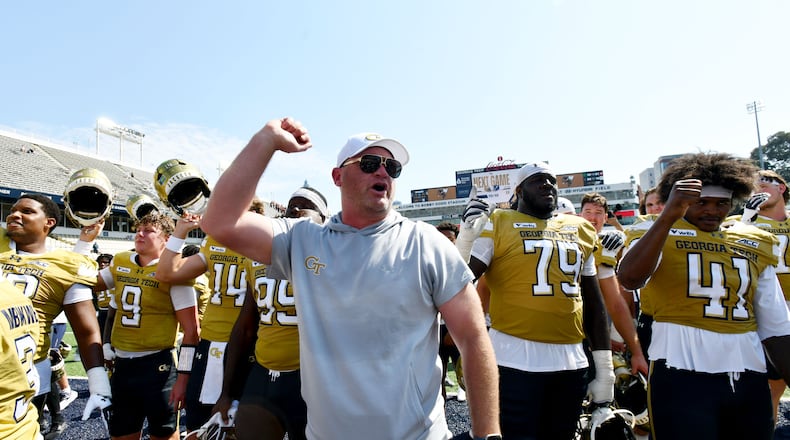Georgia Tech head coach Brent Key and players celebrate after Georgia Tech defeated Mercer during the second half of an NCAA college football game at Bobby Dodd Stadium on Saturday, Sept. 19, 2026, in Atlanta. Georgia Tech defeated Mercer 44-11. (Hyosub Shin/AJC)