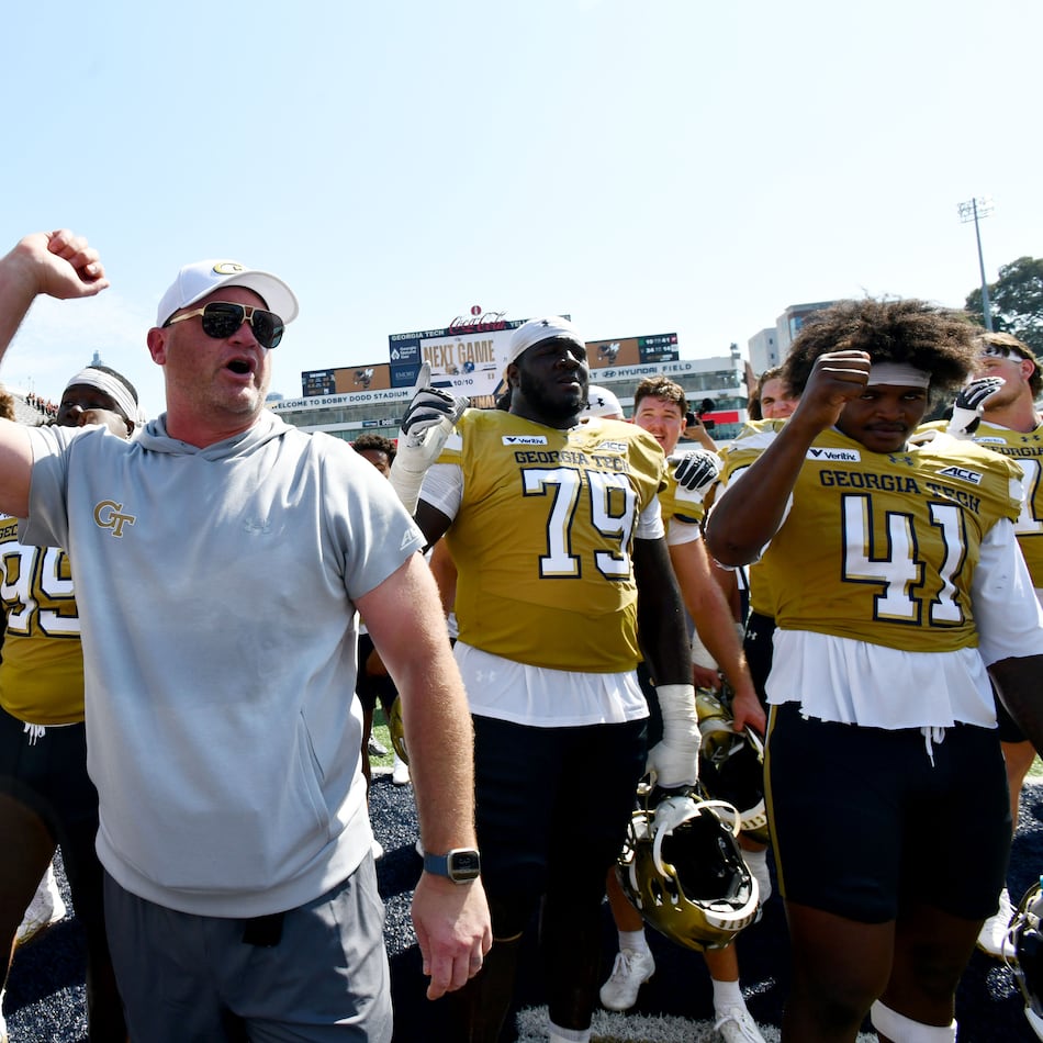 Georgia Tech head coach Brent Key and players celebrate after Georgia Tech defeated Mercer during the second half of an NCAA college football game at Bobby Dodd Stadium on Saturday, Sept. 19, 2026, in Atlanta. Georgia Tech defeated Mercer 44-11. (Hyosub Shin/AJC)