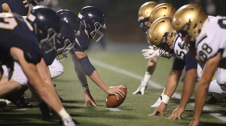 Marist prepares for an offensive play against the St. Pius defense in the first half during a 2017 playoff game. PHOTO / JASON GETZ