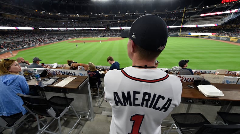 March 31, 2017, Atlanta, Georgia - Jim MaGill looks out over the new field in his custom Braves jersey near the end of the game at the Atlanta Braves Exhibition game in SunTrust Park where the Braves played the New York Yankees in Atlanta, Georgia, on March 31, 2017. (HENRY TAYLOR / HENRY.TAYLOR@AJC.COM)