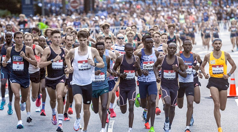 Runner compete during the 55th Peachtree Road Race in Atlanta on Thursday, July 4, 2024.  (Ziyu Julian Zhu / AJC)