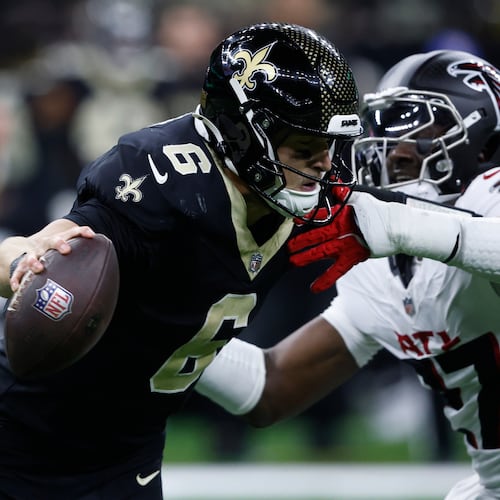 New Orleans Saints quarterback Tyler Shough (6) is sacked by Atlanta Falcons linebacker James Pearce Jr. in the second half of an NFL football game, Sunday, Nov. 23, 2025, in New Orleans. (AP Photo/Butch Dill)