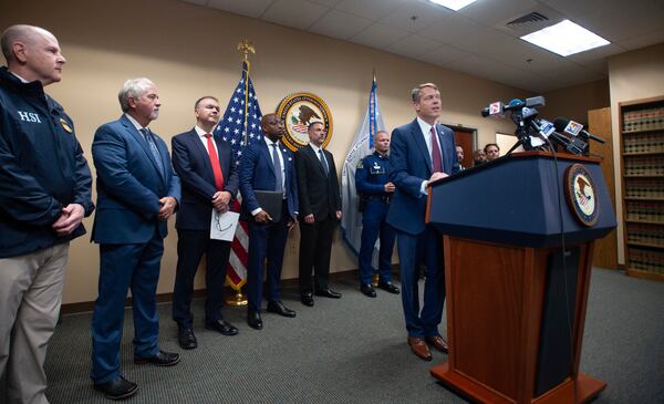 Acting U.S. Attorney Alexander C. Van Hook speaks during a press conference announcing the indictment of current and former police officers on fraud and conspiracy charges, Wednesday, July 16, 2025, at the Lafayette Federal Courthouse in Lafayette, La. (Brad Bowie/The Times-Picayune/The New Orleans Advocate via AP)