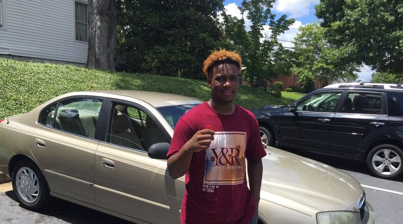 Fred Barley accepts a 2013 Hyundai Elantra from Andy Ungaro, who drove from Philadelphia to deliver the car. (Credit: Channel 2 Action News)