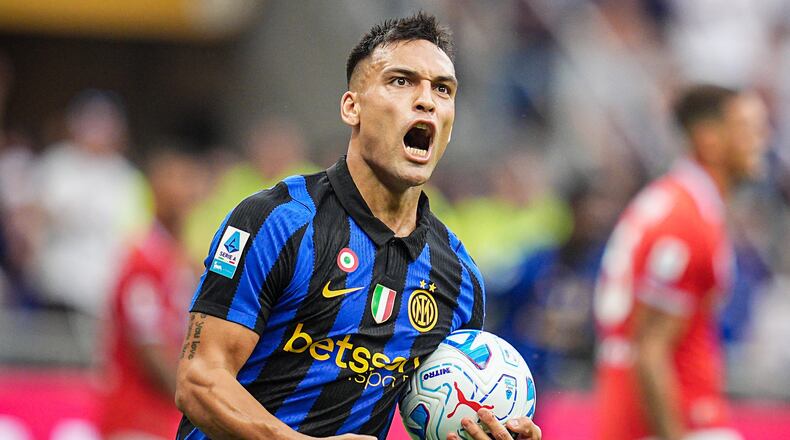 Inter's Lautaro Martinez celebrates after scoring his team's first goal during the Serie A soccer match between Inter and Napoli at the San Siro Stadium in Milan, Italy, Saturday, Sept. 5, 2026. (Marco Alpozzi/LaPresse via AP)