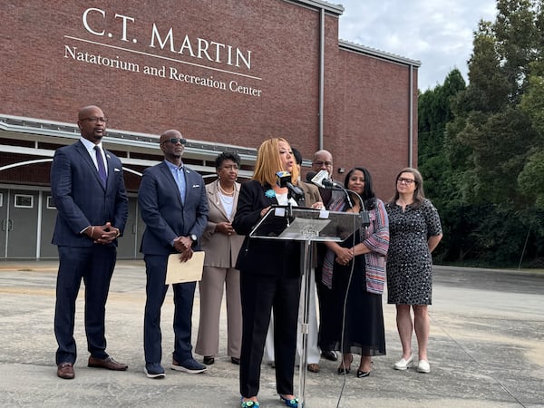 U.S. Rep. Lucy McBath, D-Marietta, flanked by labor and civil rights leaders, spoke to reporters on Thursday in Atlanta.