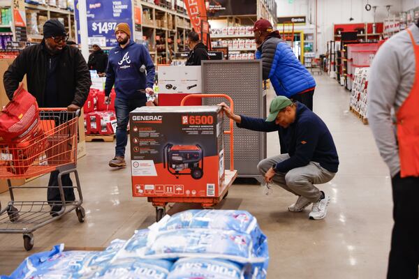 Customers shop for supplies at the Home Depot on Friday, Jan. 23, 2026, to prepare for a possible winter storm. Gov. Brian Kemp declared a state of emergency as forecasters say an ice storm could cause power outages. (Natrice Miller/AJC)