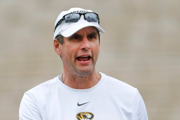 FILE - Missouri offensive coordinator Derek Dooley calls out instructions during an NCAA college football practice, Aug. 12, 2019, in Columbia, Mo. (AP Photo/Jeff Roberson, File)