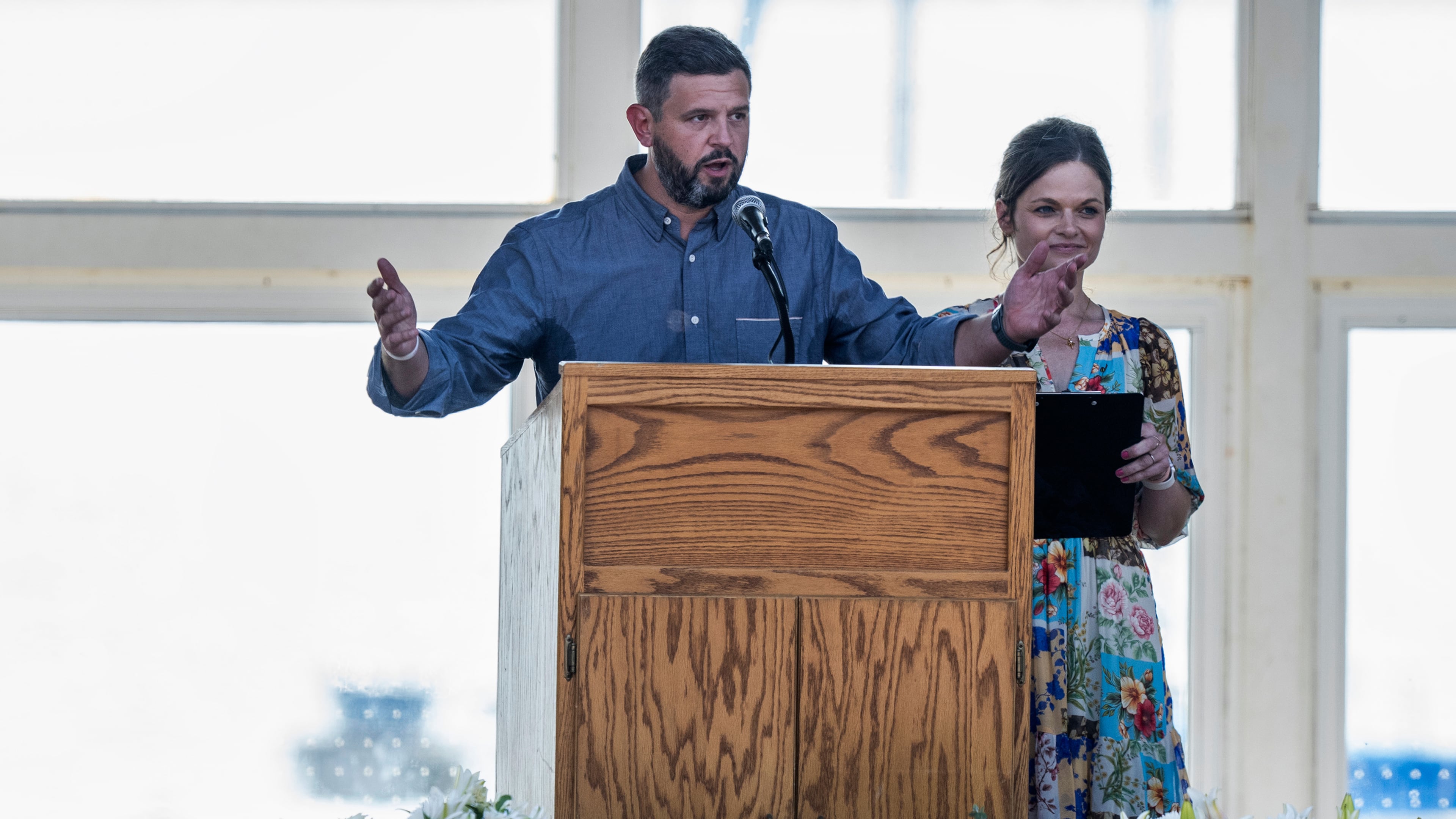 Parents Mike Moyski and Jackie Flavin thank the attendees who gathered for the celebration of life for Harper Moyski, who was killed in the Annunciation Catholic School church shooting, at the Lake Harriet Bandshell in Minneapolis, Minn., on Sunday, Sept. 14, 2025. (Richard Tsong-Taatarii/Star Tribune via AP)