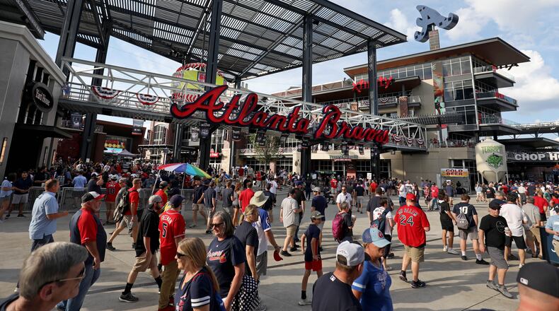 Braves fans fill the plaza outside SunTrust Park before Game 3 of the NLDS between their team and the Los Angeles Dodgers. (JASON GETZ/SPECIAL TO THE AJC)
