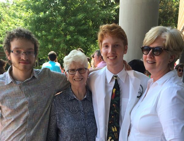 Fred Torpy was getting his lab coat in a 2018 ceremony at the University of Georgia Veterinarian School. Michael, left, was getting set to attend UGA after a yearlong break because of cancer. They are with their mom, Julie Hodack, and grandma Marge Hodack. (Credit: Bill Torpy)