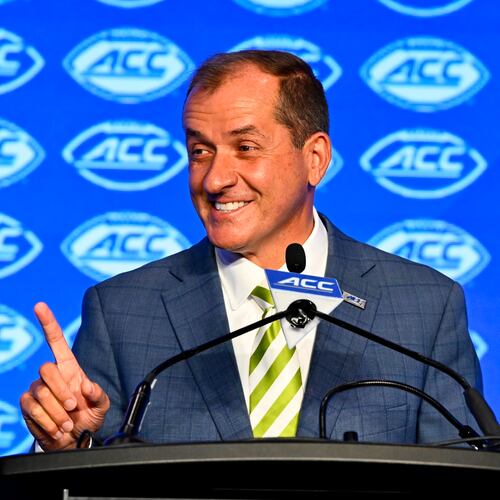 FILE - Atlantic Coast Conference commissioner Jim Phillips smiles during an NCAA college football news conference at the ACC media days, July 22, 2024, in Charlotte, N.C. (AP Photo/Matt Kelley, File)