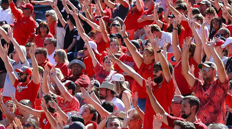 Georgia fans signal it's fourth-quarter time against Kent State during a hard-fought game Saturday, Sept. 24, 2022, in Athens. “Curtis Compton / Curtis Compton@ajc.com