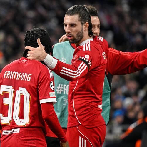Liverpool's Jeremie Frimpong, left, and Liverpool's Dominik Szoboszlai celebrate after Marseille's goalkeeper Geronimo Rulli scored an own goal during the Champions League opening phase soccer match between Marseille and Liverpool in Marseille, France, Wednesday, Jan. 21, 2026. (AP Photo/Philippe Magoni)