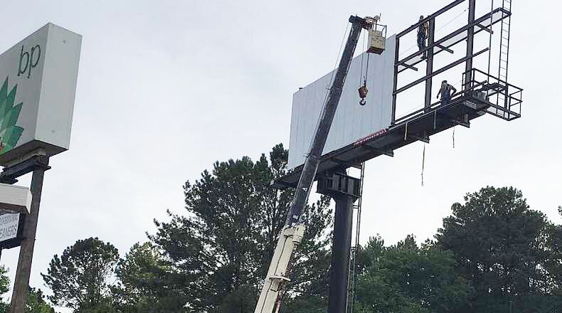 Johns Creek has called a town hall meeting to talk about billboards Feb. 9 at City Hall. AJC FILE