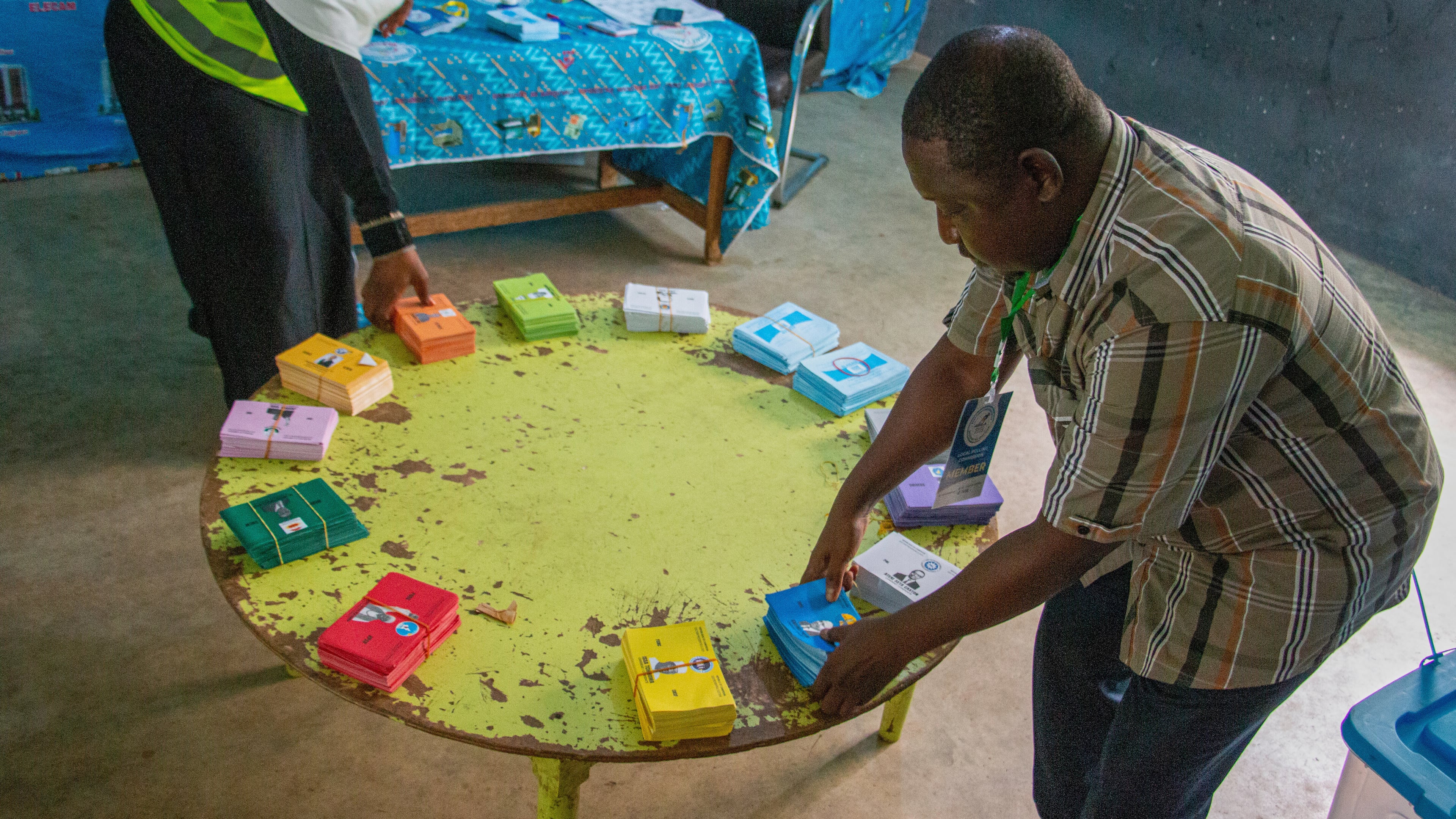 Election officials arrange stacks of ballot papers before the start of voting at a polling station in Garoua, Cameroon, Sunday, Oct. 12, 2025.(AP Photo/Welba Yamo Pascal)