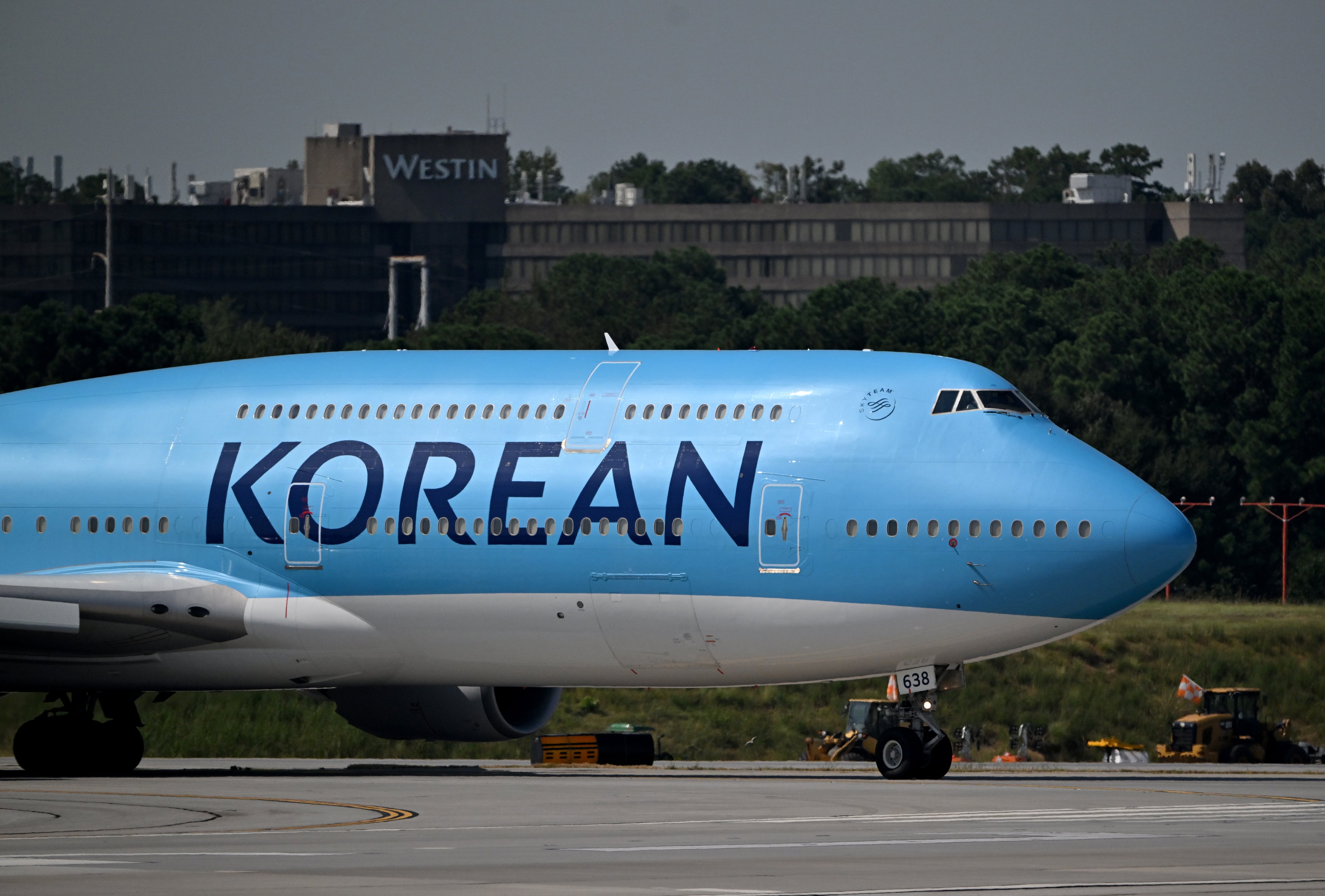The workers traveled by bus from an Immigration and Customs Enforcement detention facility in Folkston to Hartsfield-Jackson Atlanta International Airport early Thursday morning, according to The Associated Press. (Hyosub Shin/AJC)