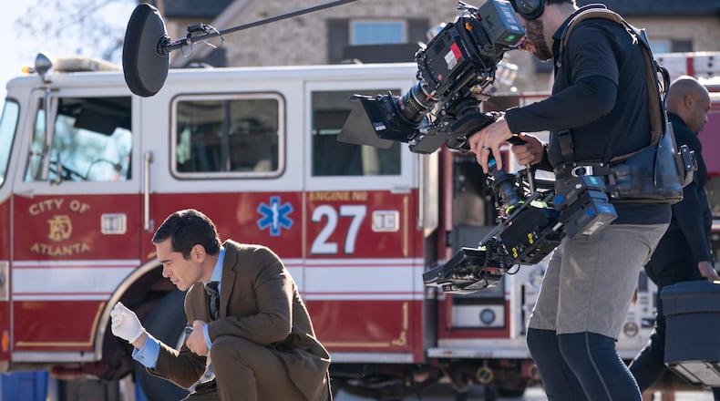 Actor Ramón Rodriguez stops to inspect evidence on the set of "Will Trent," an ABC procedural that is currently filming its third season in Georgia. The television show, which is set in Atlanta, has employed many Georgia crew workers since its start in 2022. (Disney/Daniel Delgado Jr.)