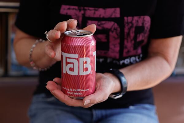 Jenny Boyter holds one of her last cans of Tab on Nov. 11, 2025. Boyter, who has been drinking Tab for decades, hopes Coca-Cola will bring back its first diet soda that was discontinued in 2020. (Natrice Miller/AJC)