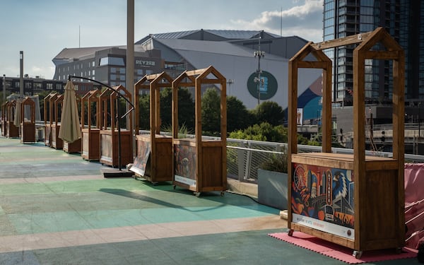 Vendor booths sit empty in the shadow of Atlanta Stadium (Mercedes-Benz Stadium) on the Steele Bridge in downtown Atlanta on June 24, 2026. (Ben Hendren for the AJC)