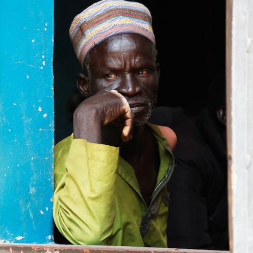 A worried parent of abducted school children looks on at St. Mary's Catholic Primary and Secondary School in Papiri community, Nigeria, Friday, Nov. 28, 2025. (AP Photo )
