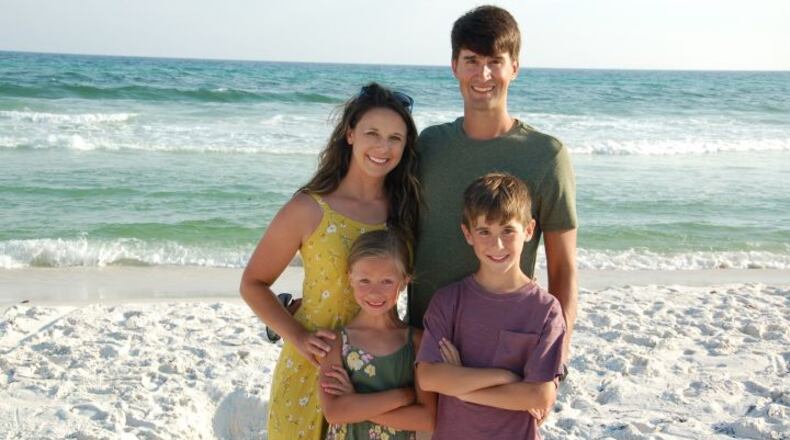 John Snyder, 35, of Peachtree City, pictured with his family. Snyder was injured in a hit-and-run crash while riding a bicycle early Saturday morning.