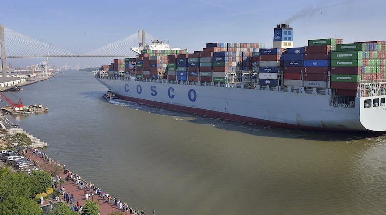A crowd of well-wishers along River Street welcome the container ship COSCO Development, Thursday morning, May 11, 2017, in Savannah, Ga, as the vessel sails up the Savannah River to the Port of Savannah. The ship is the largest vessel ever to call on the U.S. East Coast. (Steve Bisson/Savannah Morning News via AP)