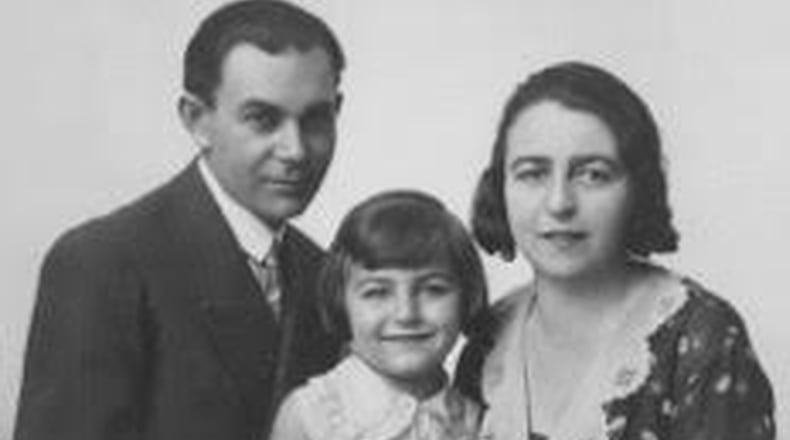 Magda Mozes Herzberger as a child in Romania with her parents, Herman and Serena Mozes. CONTRIBUTED