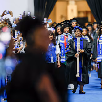 Graduates and staff are seen at the beginning of the procession during the Spelman College Commencement ceremony at the Georgia International Convention Center in College Park on Sunday, May 17, 2026. (Miguel Martinez/AJC)