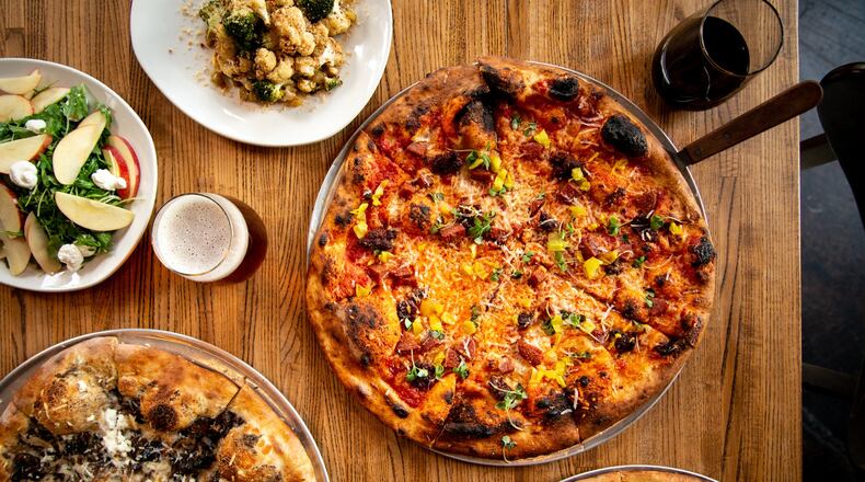 MTH Pizza The Hell Boy Pizza, Clammed if You Do, Funghi, Georgia Apples and Arugula Salad, and Roasted Broccoli and Cauliflower. Photo credit- Mia Yakel.