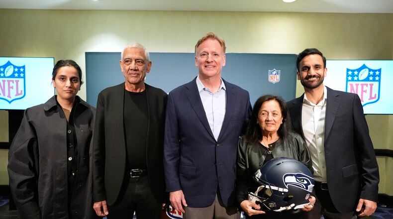 Seattle Seahawks owner's The Khosla family, and NFL commissioner Roger Goodell, Nina Khosla, left, Vinod Khosla, Neeru Khosla, and Neal Khosla pose for a portrait during a news conference at an NFL football owners meeting on Wednesday, Aug. 26, 2026, in Atlanta. (AP Photo/Brynn Anderson)