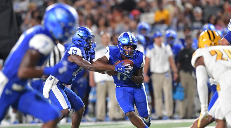 Georgia State quarterback Dan Ellington (13) hands off to running back Destin Coates (17) against Kennesaw State at Georgia State Stadium on Thursday, August 30, 2018. HYOSUB SHIN / HSHIN@AJC.COM