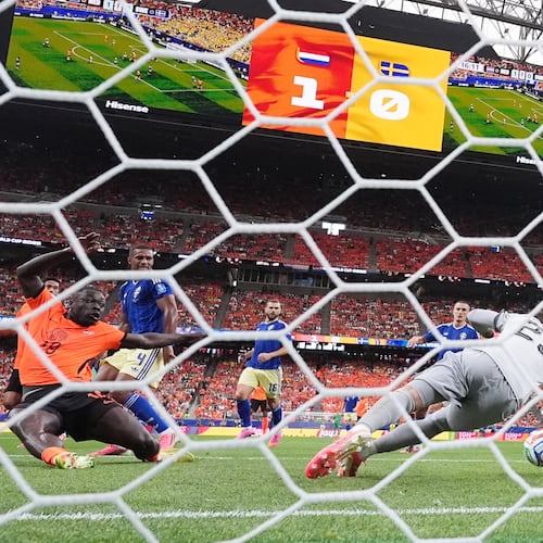 Netherlands' Brian Brobbey (19) scores their second goal past Sweden goalkeeper Kristoffer Nordfeldt (23) during the World Cup Group F soccer match between the Netherlands and Sweden in Houston, Saturday, June 20, 2026. (AP Photo/Eric Gay)