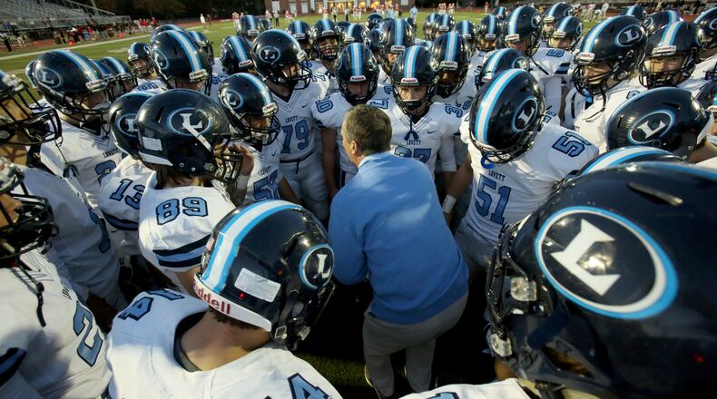 Lovett head coach Mike Muschamp rallies his team. (Jason Getz/For the AJC)