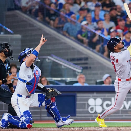 Boston Red Sox's Ceddanne Rafaela, right, flies into a sacrifice double play that was reviewed with a time play allowing Anthony Seigler (not shown) to score against the Toronto Blue Jays during the seventh inning of a baseball game in Toronto, Monday, Aug. 10, 2026. (Sammy Kogan/The Canadian Press via AP)