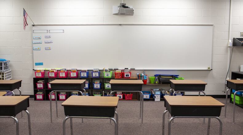 Desks are seen socially distanced in Northbrook Middle School in Suwanee on Wednesday, July 8, 2020. Many metro Atlanta districts have since opted to go online-only this fall. REBECCA WRIGHT FOR THE ATLANTA JOURNAL-CONSTITUTION