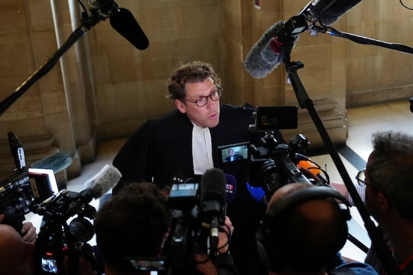 Joseph Hazan, a lawyer for Aomar Aït Khedache, one of the men accused in the 2016 armed robbery of Kim Kardashian, talks top the press at the palace of justice Monday, April 28, 2025 in Paris. (AP Photo/Aurelien Morissard)