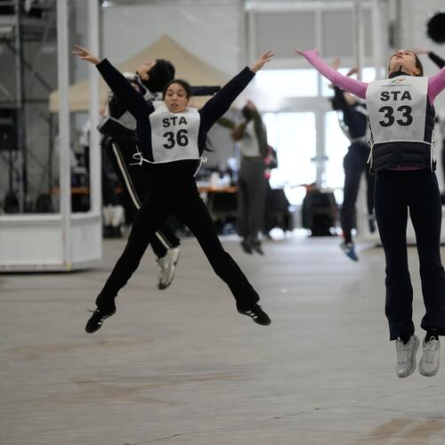 Volunteer dancers perform during rehearsals for the opening ceremony of the Milan Cortina 2026 Winter Olympic Games, at a compound in a big tent next to San Siro Stadium, in Milan, Italy, Saturday, Jan. 24, 2026. (AP Photo/Luca Bruno)