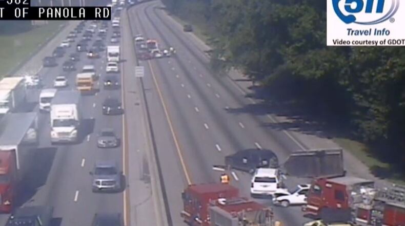 An overturned vehicle had all westbound lanes of I-20 shut down in DeKalb County Friday morning.