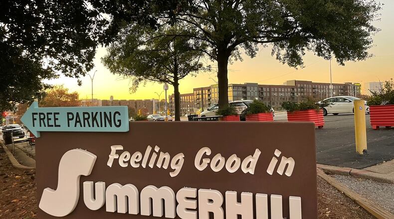 The Summerhill neighborhood has blossomed now that the acres and acres of land once reserved for Braves parking can be developed. In the background are the 565 Hank luxury apartments. (Photo by Bill Torpy)