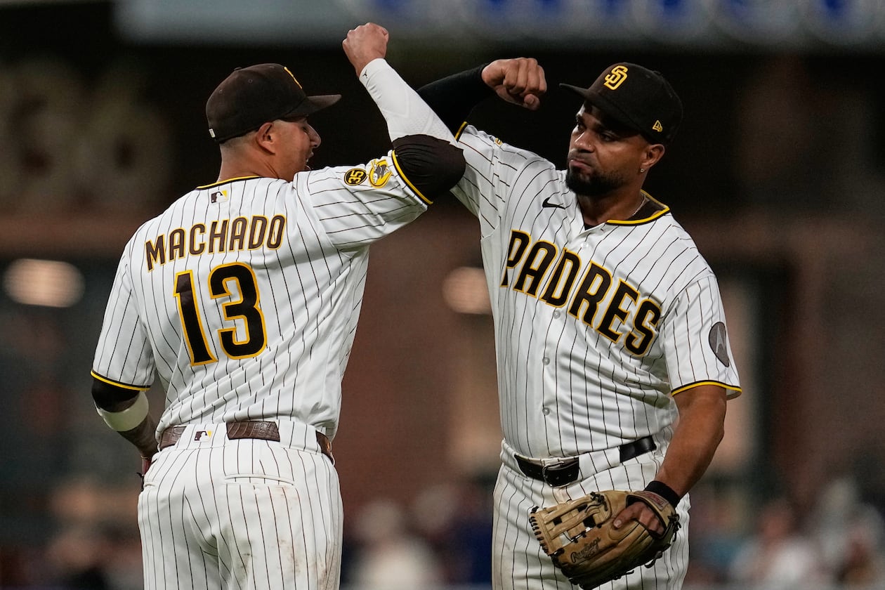 Padres third baseman Manny Machado (left) celebrates his winning homer with shortstop Xander Bogaerts after defeating the Braves, 1-0, on Monday, June 22, 2026, in San Diego. (Gregory Bull/AP)