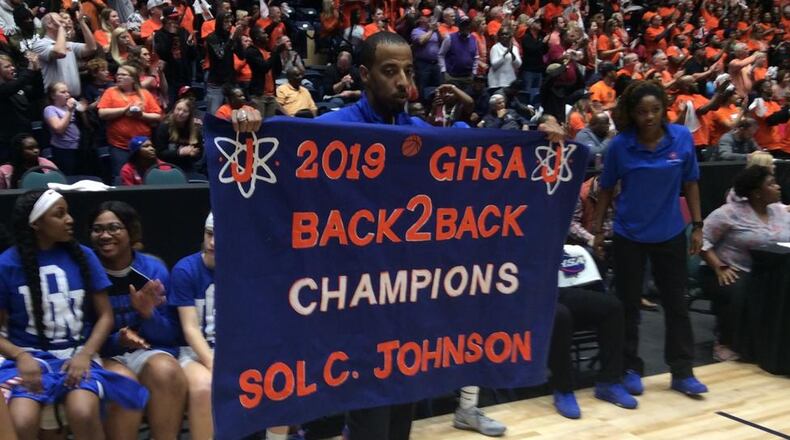 Brandon Lindsey celebrates Johnson's second-straight state championship.