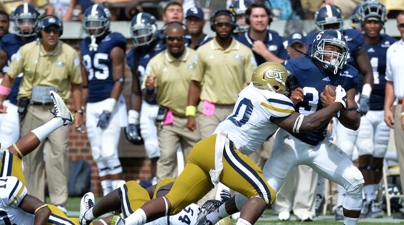September 13, 2014 Atlanta - Georgia Southern Eagles running back Matt Breida (36) runs away from Georgia Tech Yellow Jackets running back Synjyn Days (10) in the second half at Bobby Dodd Stadium on September, 13, 2014. Georgia Tech Yellow Jackets won 42 - 38 over the Georgia Southern Eagles. HYOSUB SHIN / HSHIN@AJC.COM