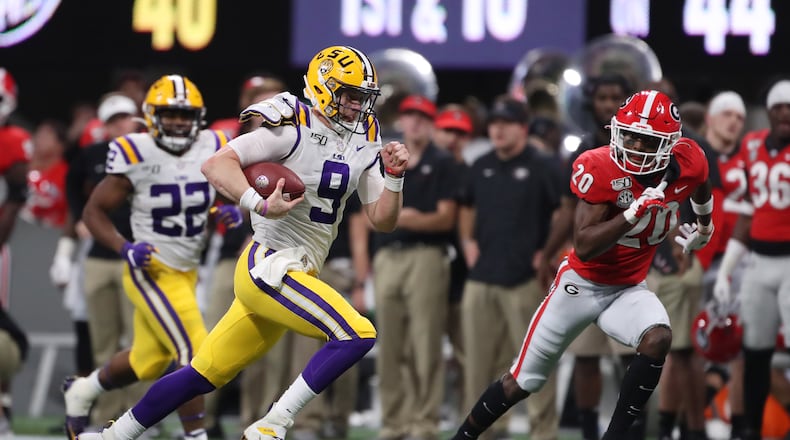 12/7/19 - Atlanta -  LSU Tigers quarterback Joe Burrow (9) runs on a keeper play during the first half of the Georgia vs. LSU SEC Football Championship game at Mercedes-Benz Stadium in Atlanta.  Alyssa Pointer / alyssa.pointer@ajc.com