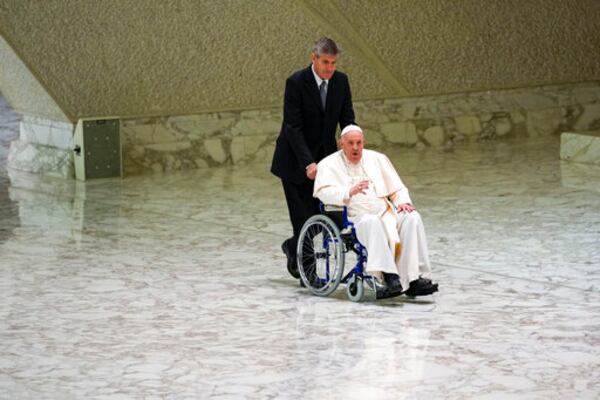 FILE - Pope Francis arrives in a wheelchair to attend an audience with nuns and religious superiors in the Paul VI Hall at The Vatican, Thursday, May 5, 2022. (AP Photo/Alessandra Tarantino, File)