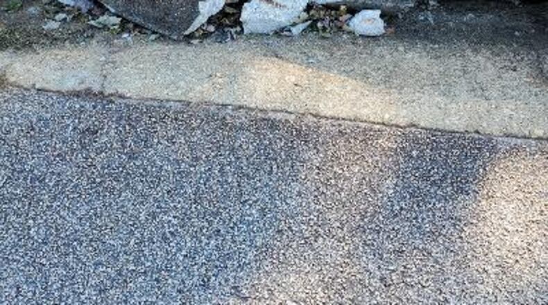 Diane Dale hopes this pavement will soon be repaired.